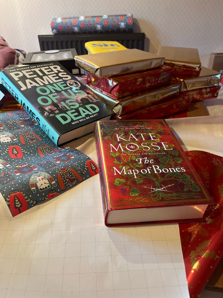 Pile of wrapped books for Christmas.