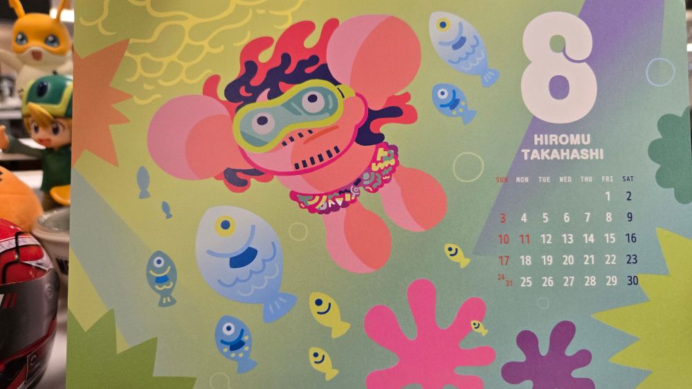 A calendar with an anime Hiromu Takahashi  snorkeling with fish. 