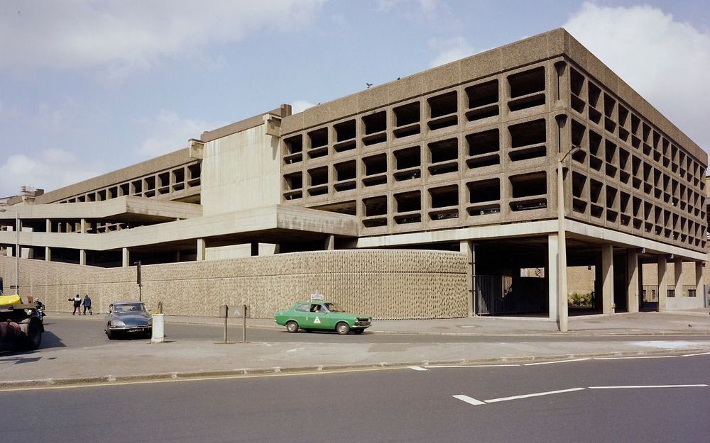 A colour photograph of the Minories car park, built in textured concrete 
