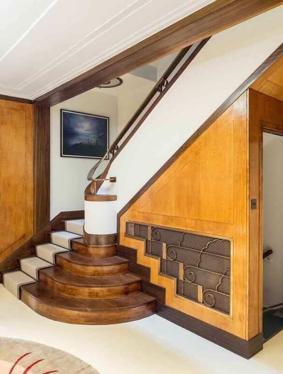 A colour photograph of an art deco staircase and hallway at 63 Harley Street