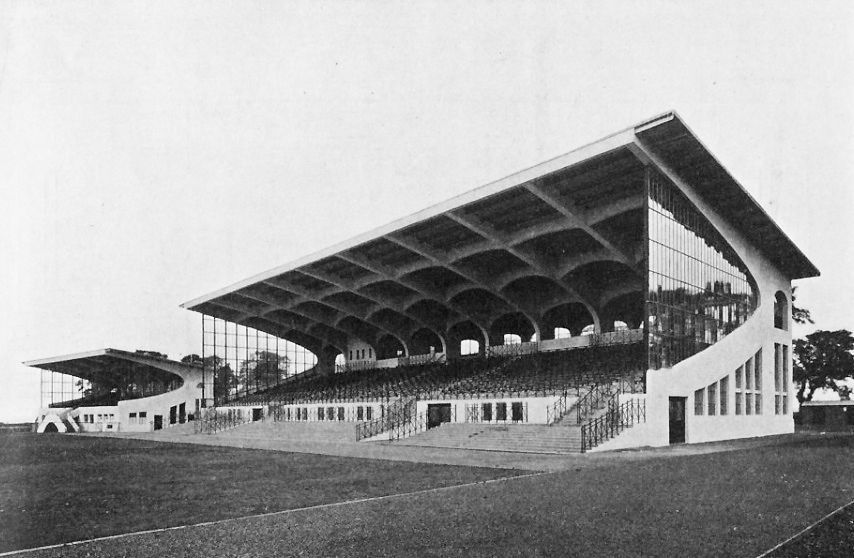 A black and white photograph of two concrete and glass stands at Northolt Racecourse, now demolished 
