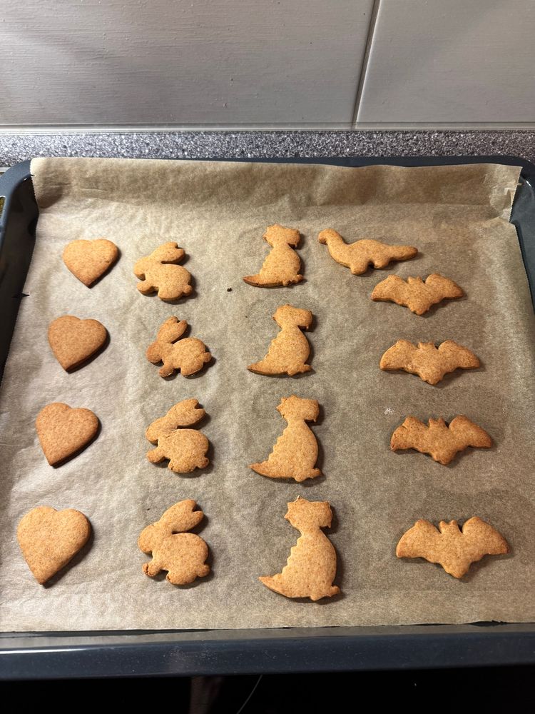 Gingetbread cookies in heart, bunny, dragon and batman sign shape