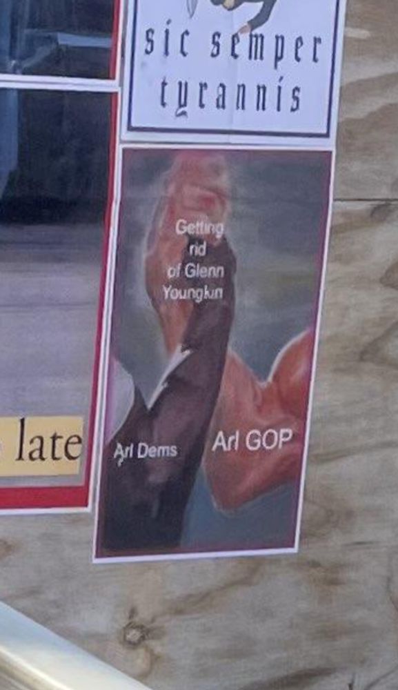 Wheat paste of the epic handshake labeled arlGOP Arl Dems, agreeing on getting rid of Glenn younylon 