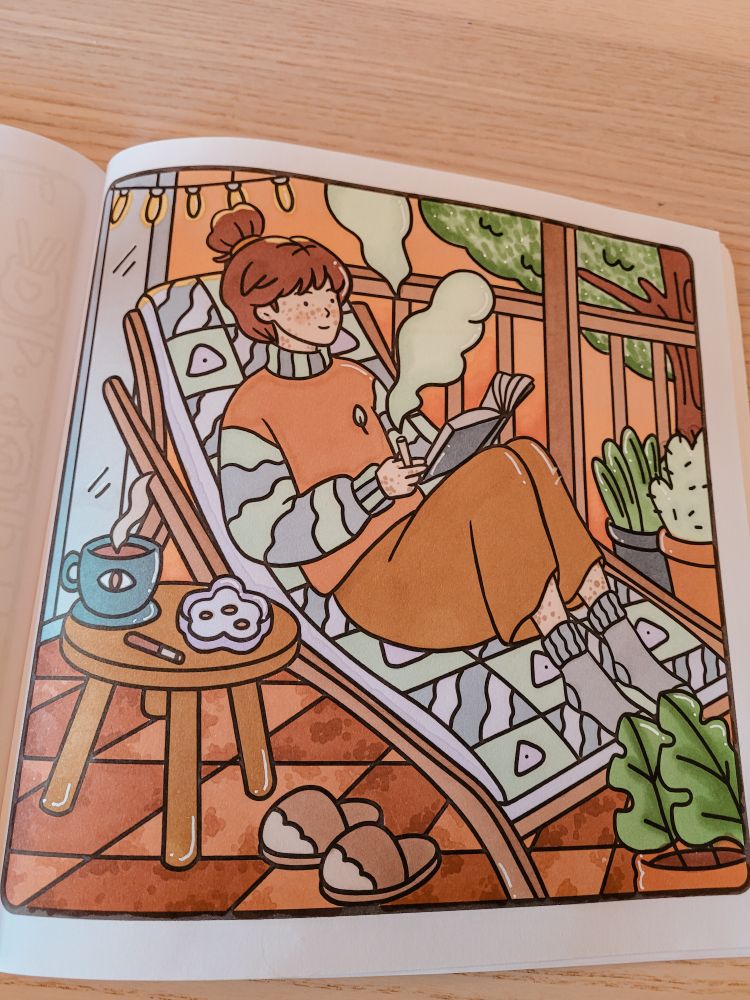 coloring page of a white girl with brown hair and freckles sitting out on her outdoor porch reading and smoking marijuana. the colors are very fall like with terracota tiles, an orange sunset, green plants etc. her outfit and chair are purple, blue, green, orange and brown. 