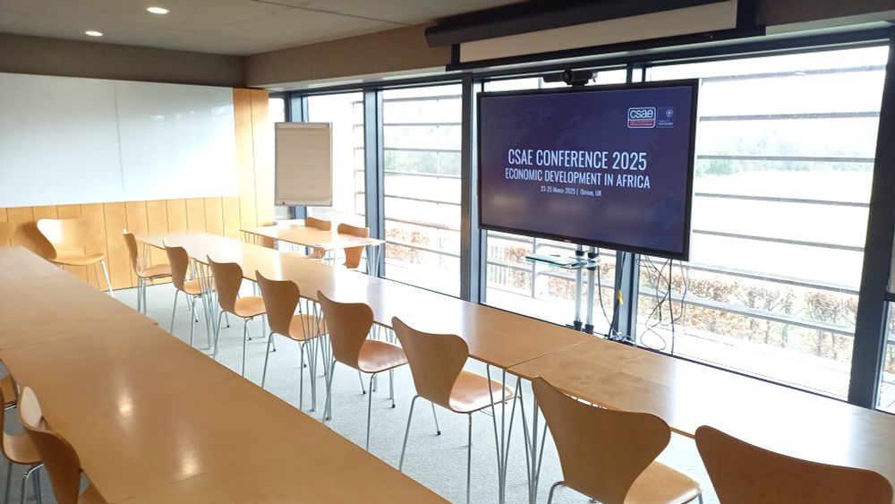 Empty Seminar room at St Catherine's College with TV screen 