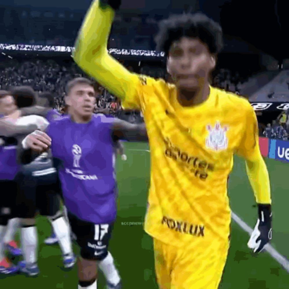 a soccer player wearing a yellow jersey that says fox lux