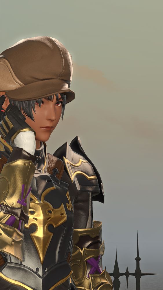 a closer photo of the young woman. she's got a brown cap with her black hair peeking out. her eyes are dark. she looks towards the camera, focused and slightly dour. her armor is dark grey and gold, with white and purple accents.