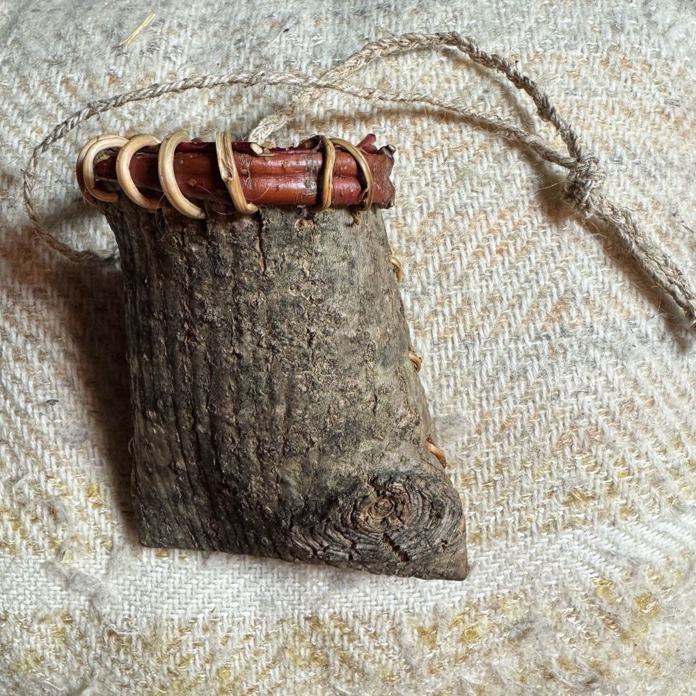 Mokok - a North East Native American style basket made with the outer bark showing and stitched with spruce root - back view showing eye like form at lower right where a branch had grown out