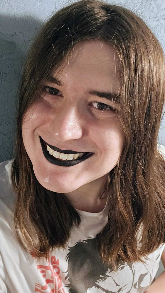 Isabella wearing black lipstick while wearing a Cowboy Bebop t shirt