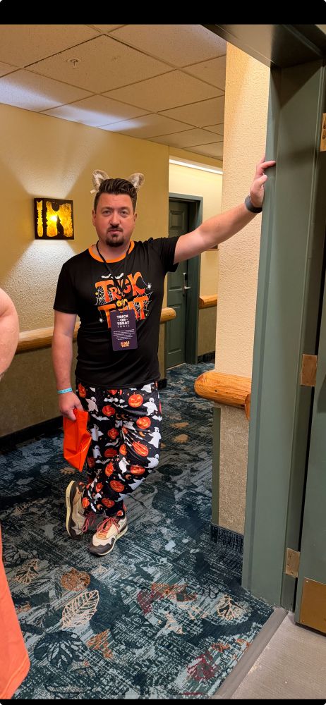 A young man dressed in Halloween 
trick or treat outfit. 
