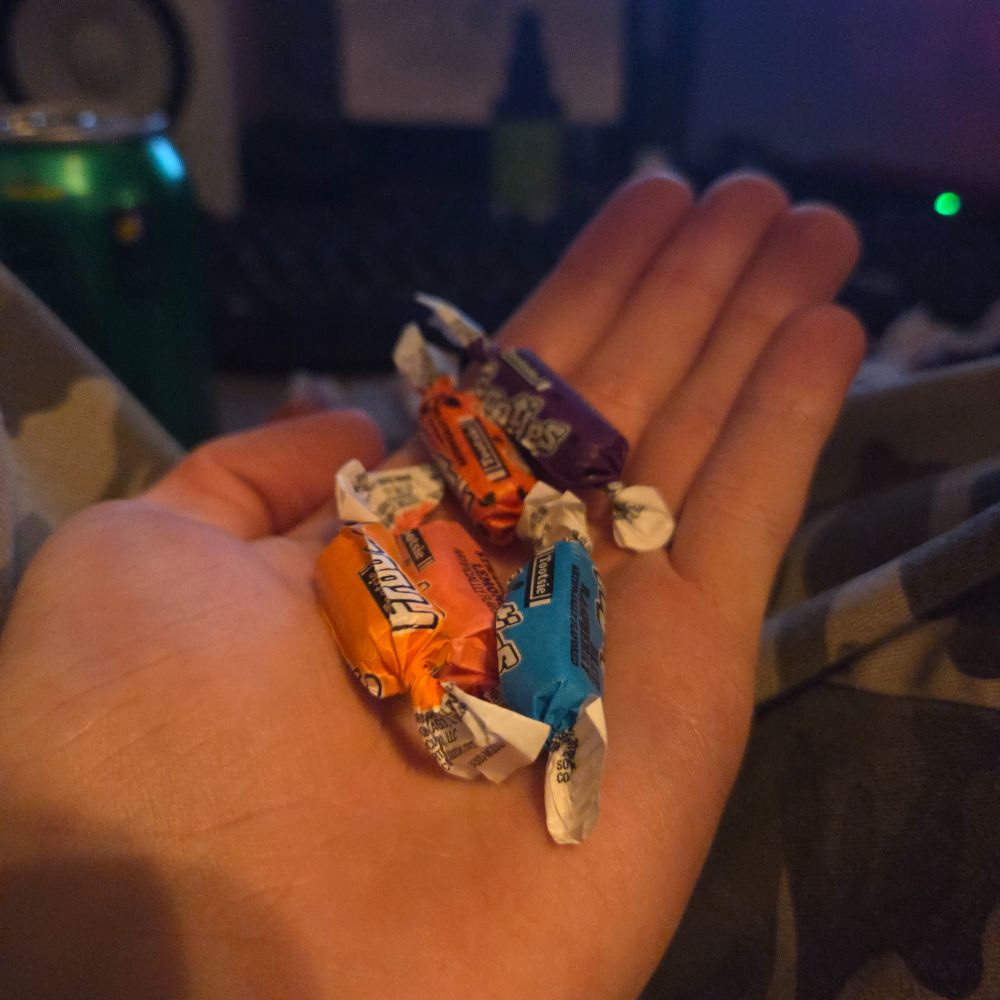 A handful of Frooties candies in different flavors.