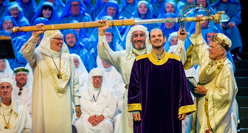 Chairing of the bard in an Eisteddfod. Druids, robes, a throne and a massive sword.