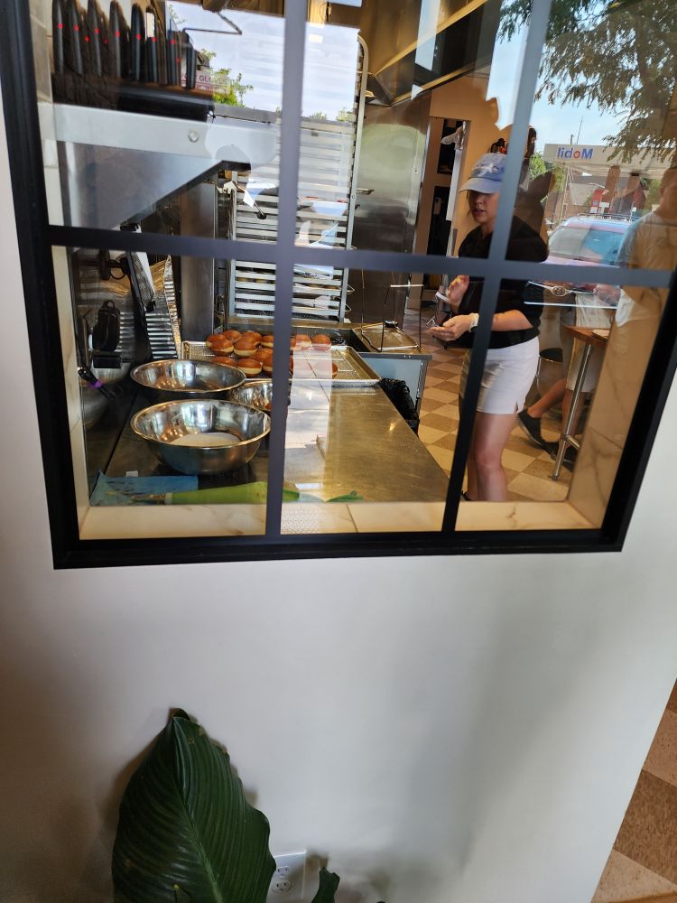 View into the kitchen where they're preparing the malasadas 
