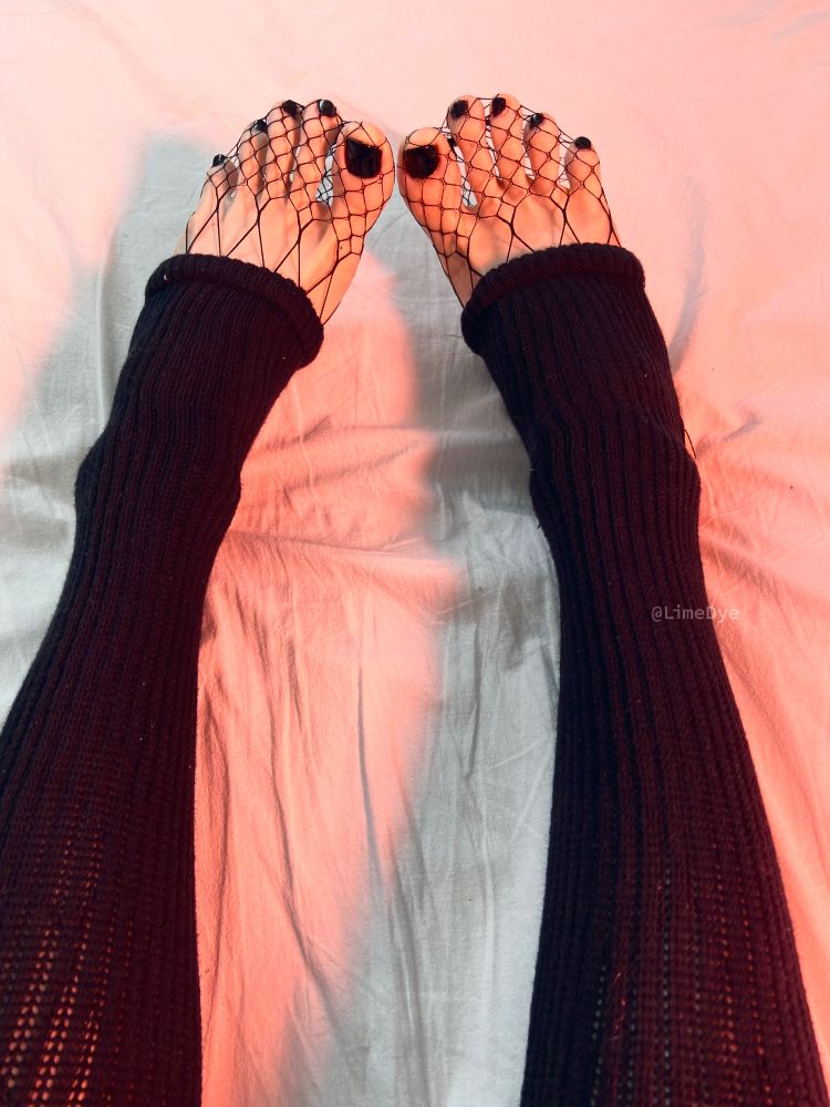 A close-up on my feet with my toes spread.