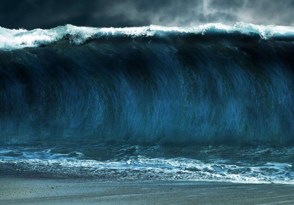 An image of a large tsunami from shore.