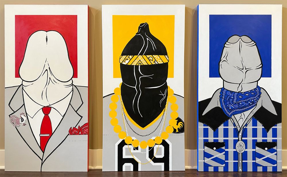 Three large canvases stand against the wall. The first has a red square in the background and a large dick wearing a suit with a red tie and red hankie and rooster brooch. The second has a yellow square, and features and uncut dick wearing a football jersey, fan beads, and a yellow bandanna. The third has a blue background and features a cock wearing hipster/western attire with a bolo tie featuring another rooster image.