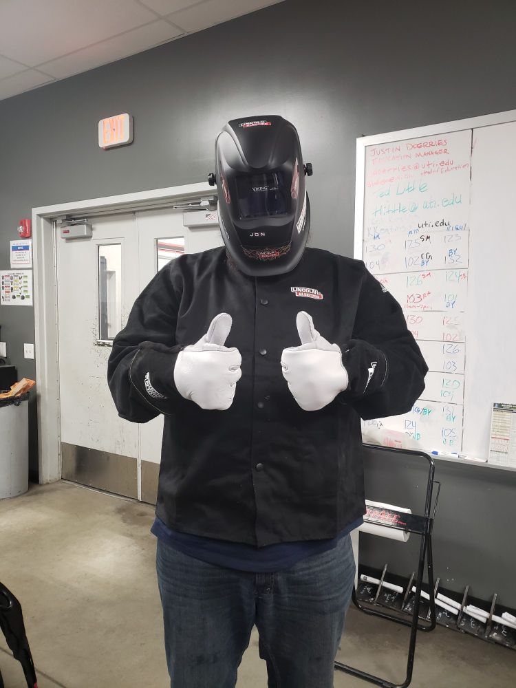 Jd, all set and ready to start welding with his helmet,gloves, and jacket.