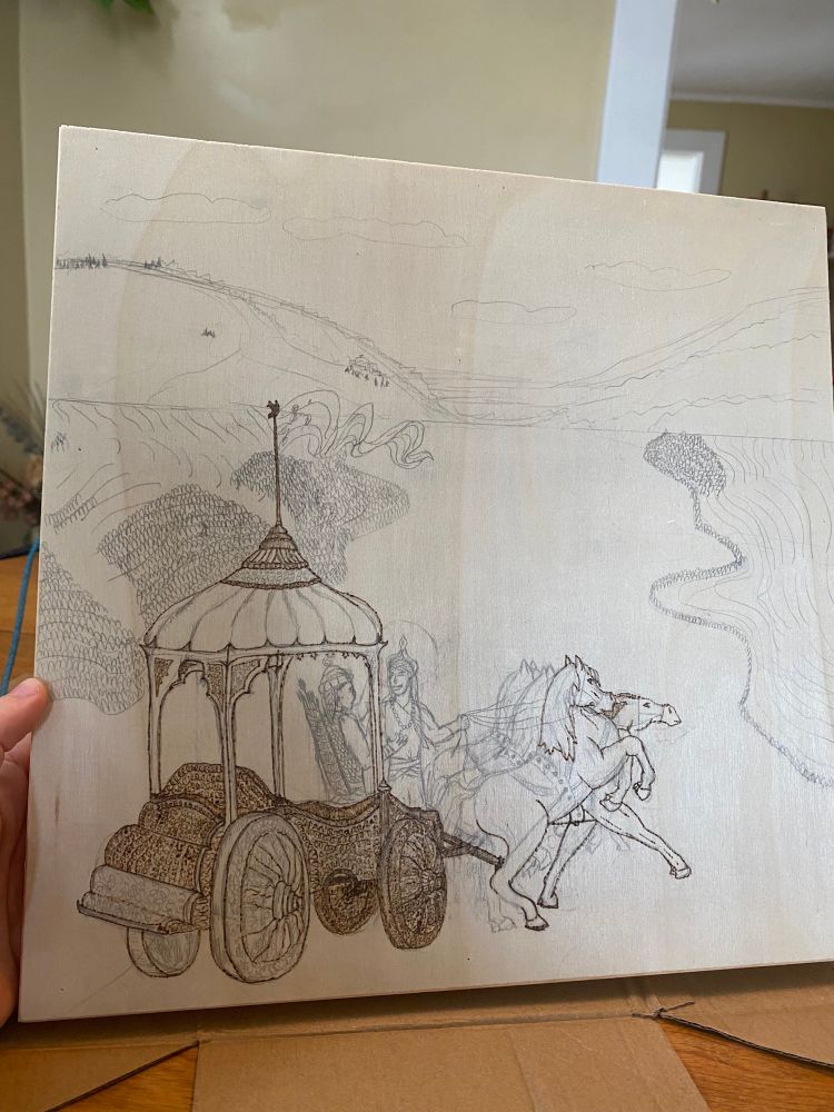 An active wood-burning WIP depicting Krisna and Arjuna before the battle 