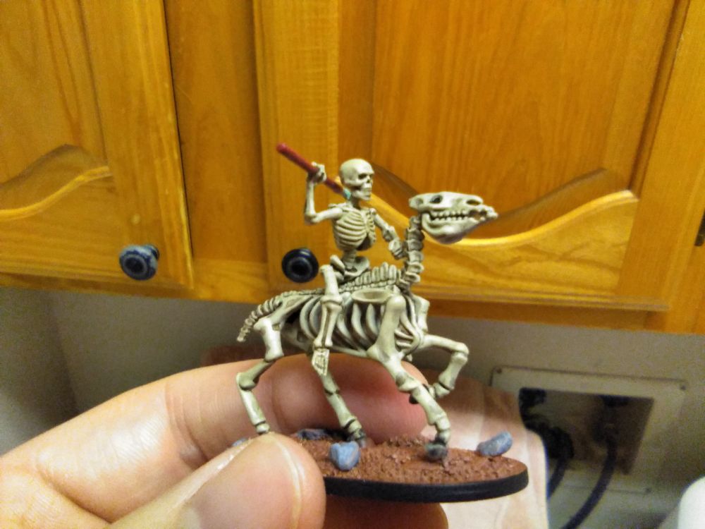 Miniature: Skeleton cavalrymen, spear resting over shoulders.