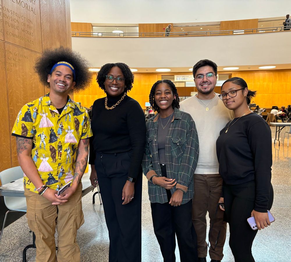 Mychal smiles with Brooklyn Public library workers 