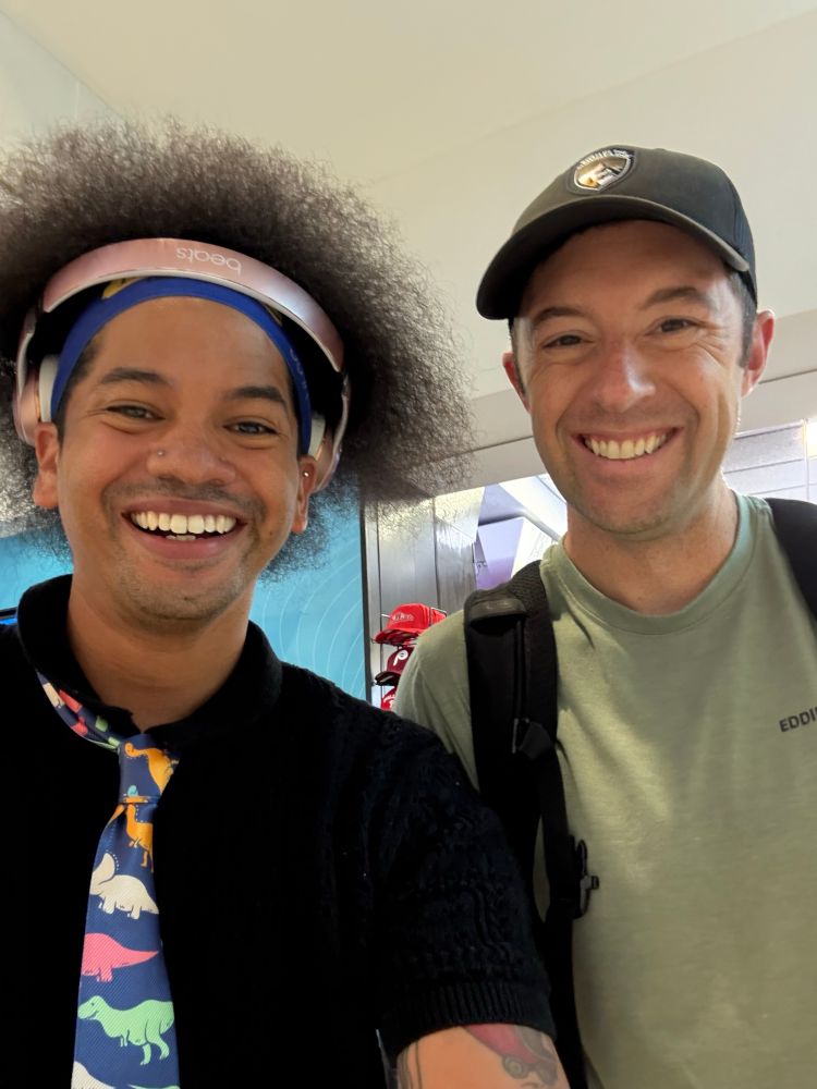 Mychal and Matt Eicheldinger smile together for a photo 