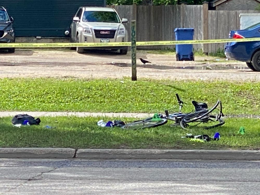 Rob Jenner’s bike lays mangled along Wellington Cres with police evidence numbers placed on and nearby. The rear wheel is bent horribly out of shape. 