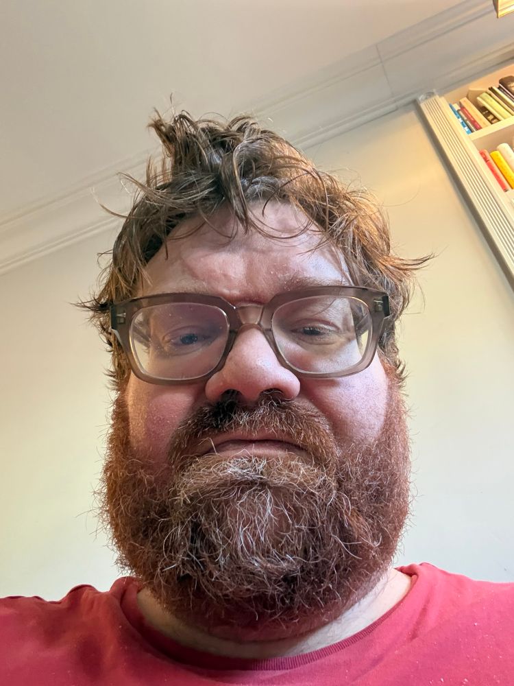 Reverse camera photo of Tim Carmody, big red-bearded guy with glasses who looks a fucking mess