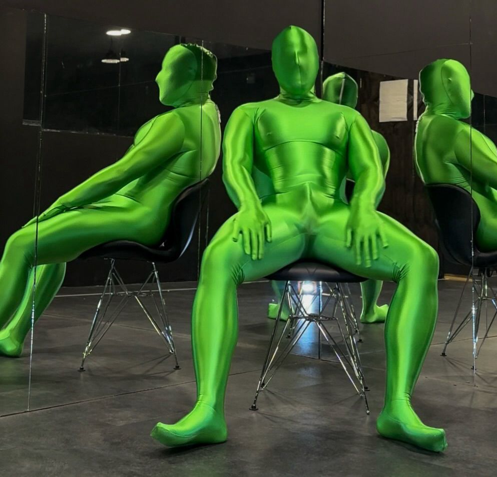 Man in shiny green lycra spandex zentai suit