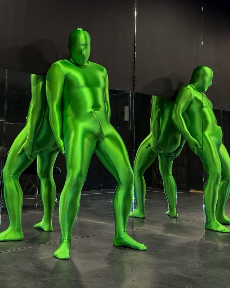 Man in shiny green lycra spandex zentai suit