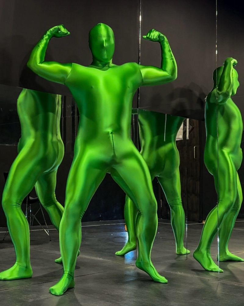 Man in shiny green lycra spandex zentai suit