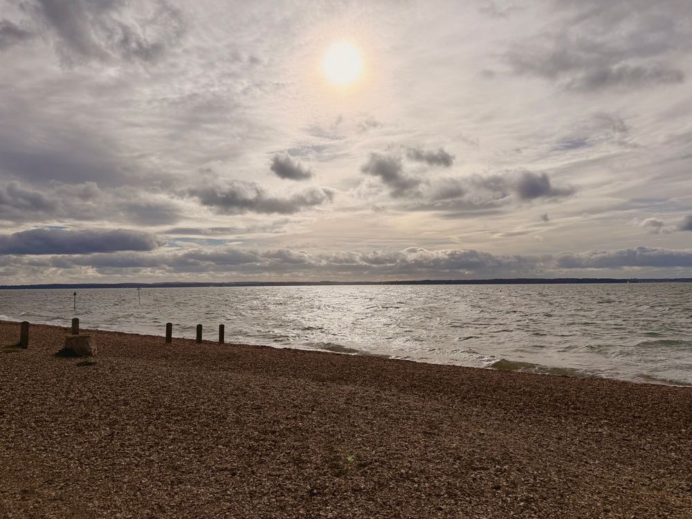 An image of a the beach at Lee on Solent with the sun illuminating a beautiful cloud formation.
