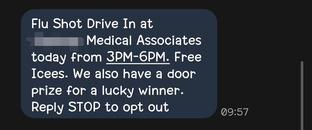 Screenshot of a text message with some text censored for privacy. It reads, "Flu Shot Drive In at [censored] Medical Associates today from 3PM-6PM. Free Icees. We also have a door prize for a lucky winner. Reply STOP to opt out"
