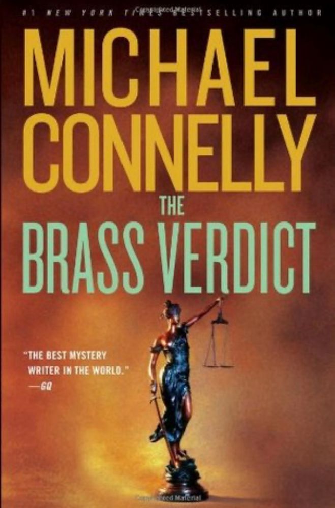 Cover of Michael Connelly’s Brass Verdict novel. Orange background with yellow lettering and a metal statue of A woman holding the scales of justice. 
