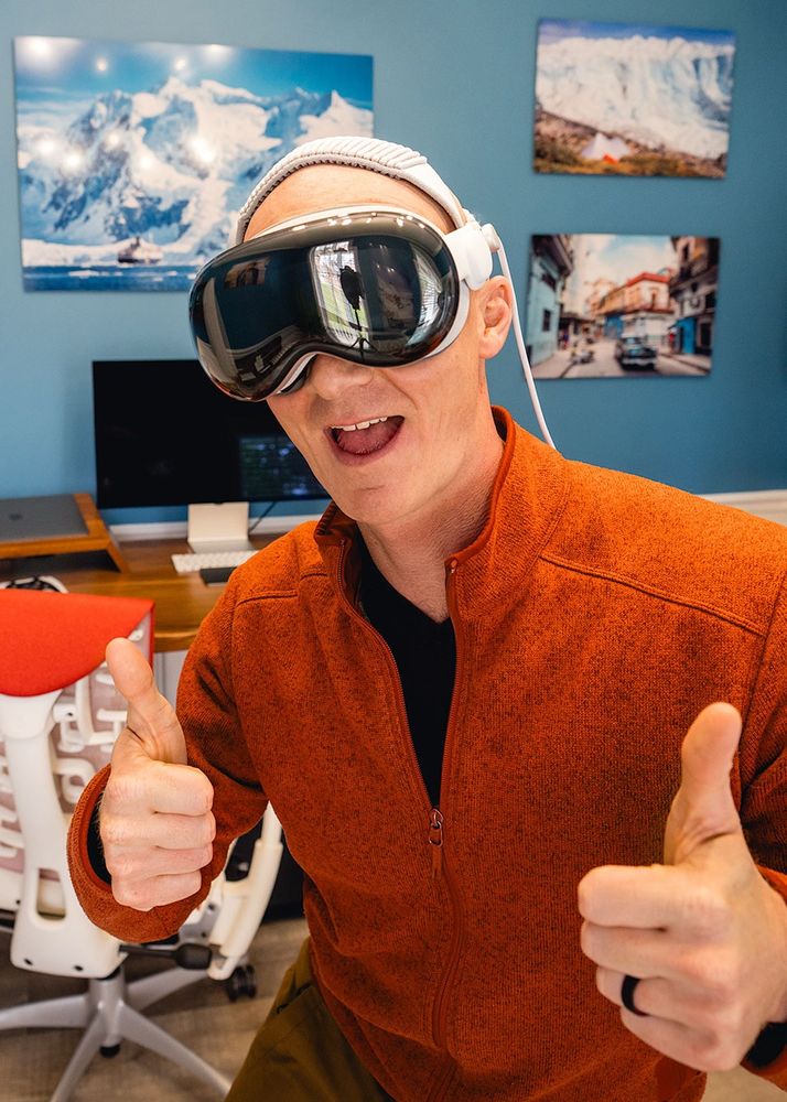 Selfie in office wearing my Apple Vision Pro headset and thumbs up.