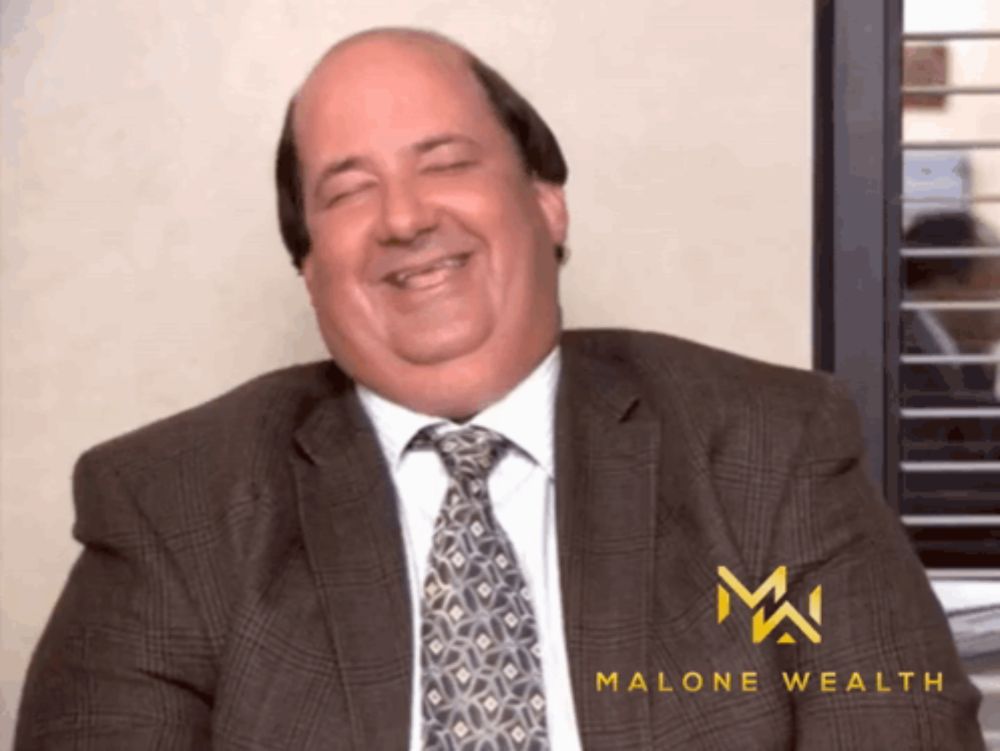 a man in a suit and tie is smiling with the words malone wealth in the corner