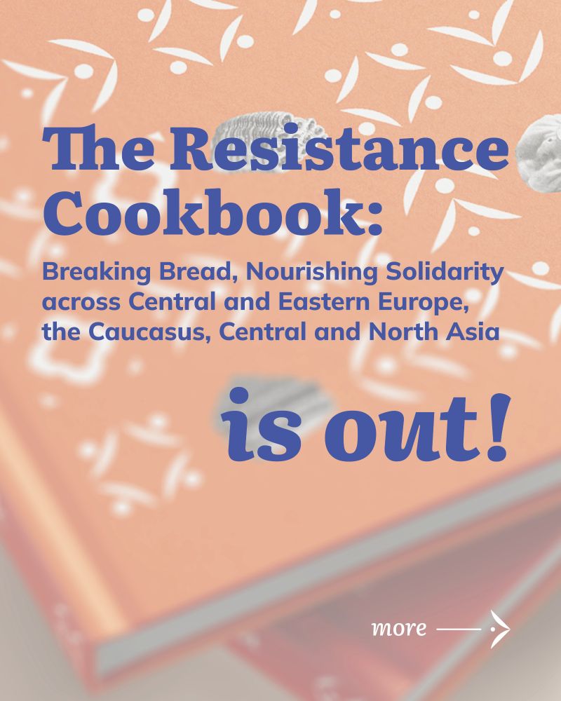 A promotional graphic announcing the launch of The Resistance Cookbook. The background features a close-up of two orange hardcover books with white folk-style patterns resembling embroidered or woven textile designs. The patterns include dots, leaves, and abstract floral shapes. The text in the foreground reads: “The Resistance Cookbook: Breaking Bread, Nourishing Solidarity across Central and Eastern Europe, the Caucasus, Central and North Asia is out!” in bold, dark blue font. In the lower right corner, smaller white text reads “more →” with an arrow pointing right, suggesting a clickable link or further information. The image conveys a sense of celebration and cultural richness, blending visual motifs of tradition and activism.