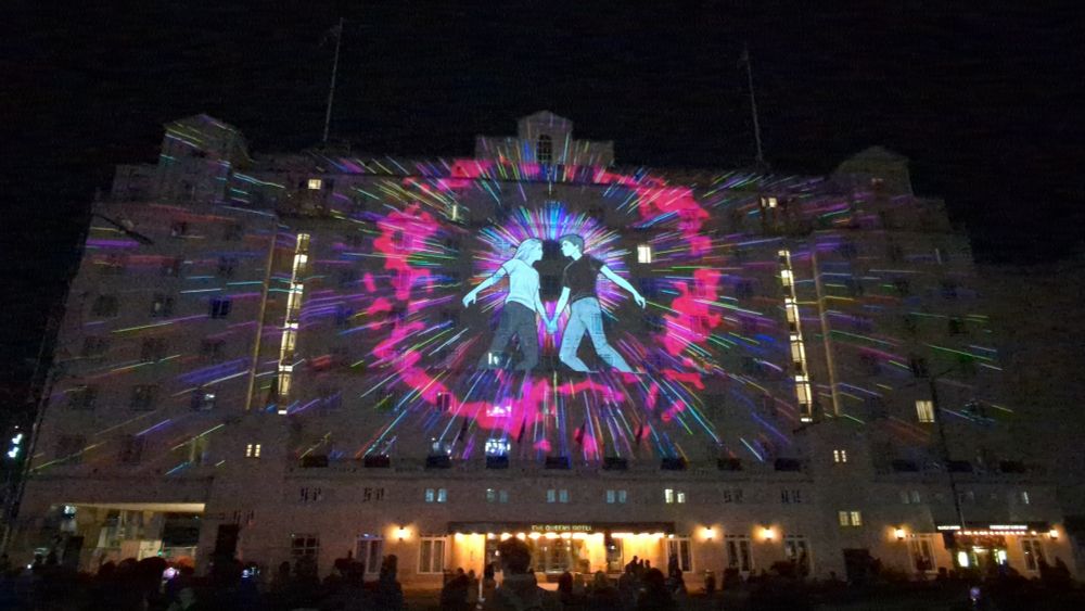 A multicoloured projection on the Queen's Hotel.