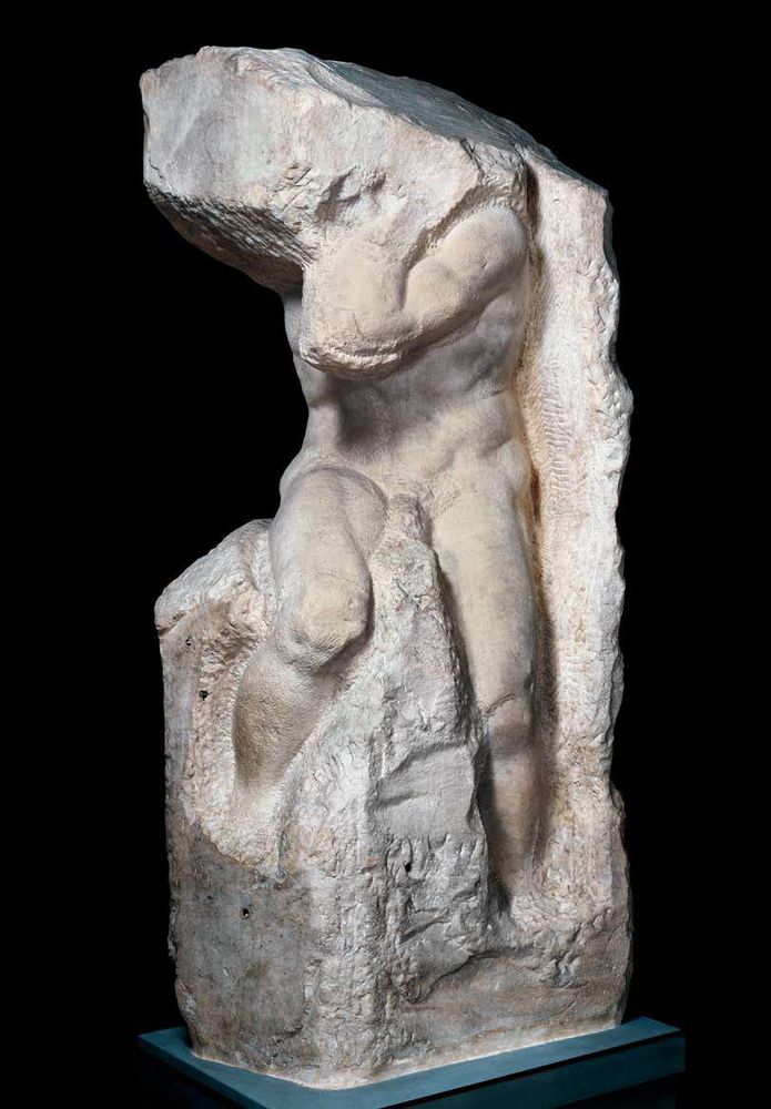 Michealangelo's non-finito sculpture. Male figure appears to be trying to break free from the marble block.