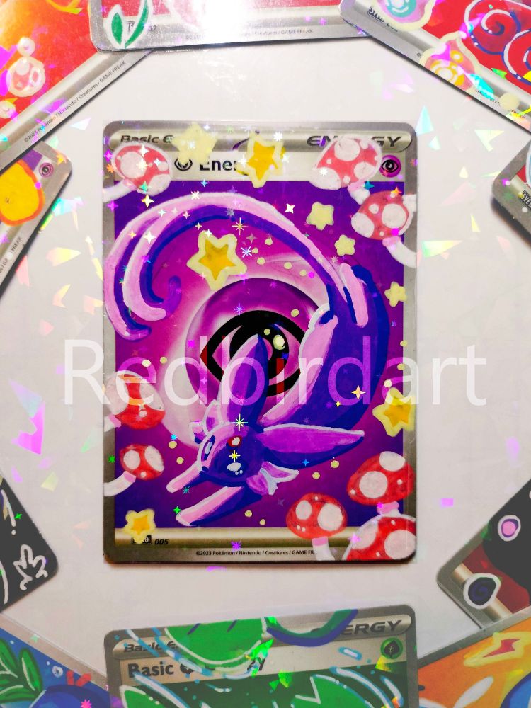 An energy card from the pokemon tcg, an espeon is painted on it with posca pens