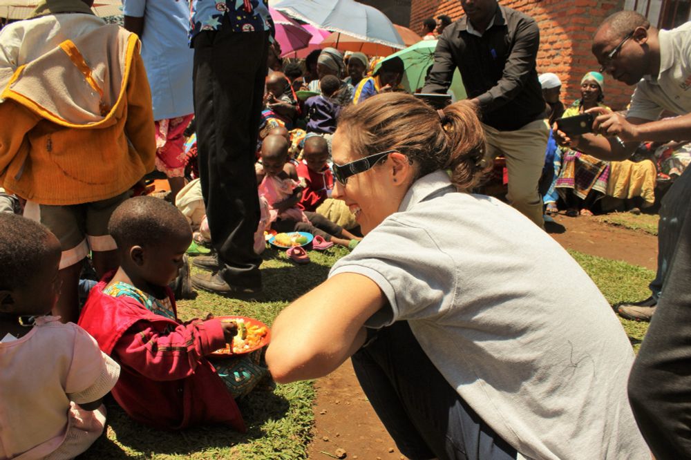 Sister feeding kids