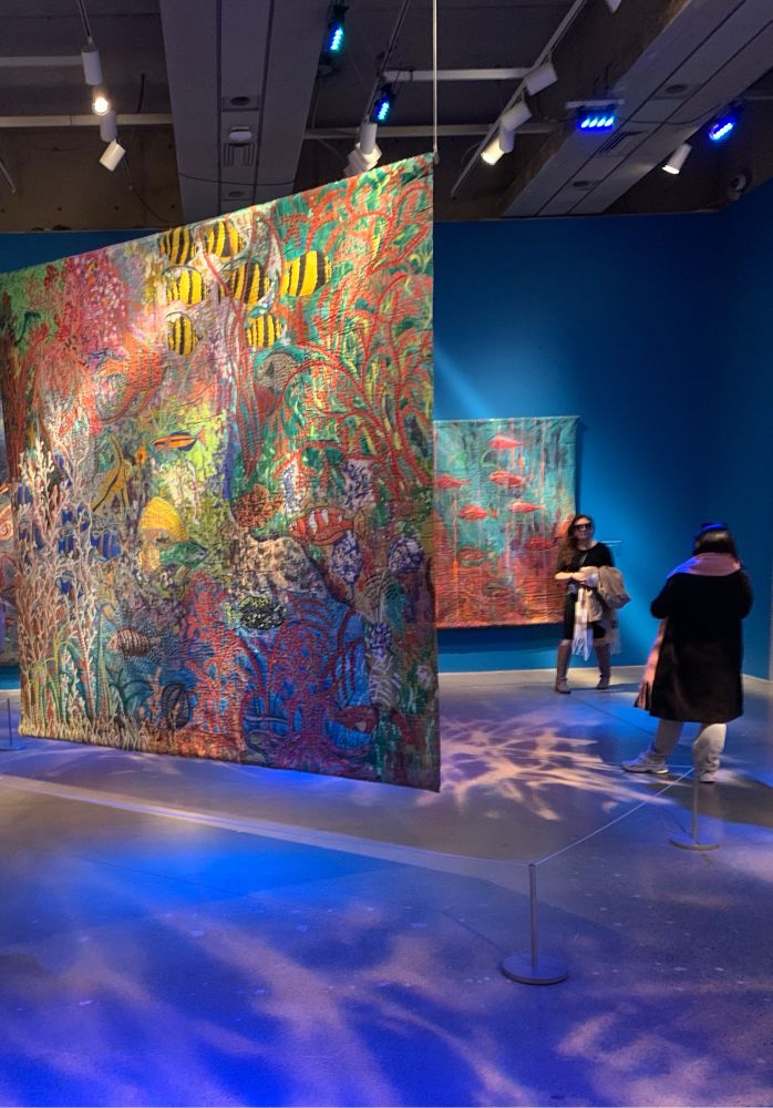 Two large trapunto paintings of colourful underwater life