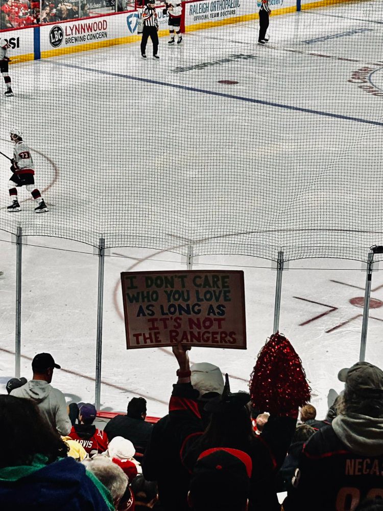 Fan with sign that says 