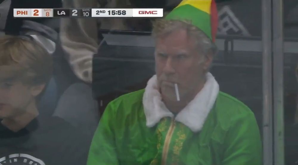 Grumpy Buddy the elf with a cig at a Kings game