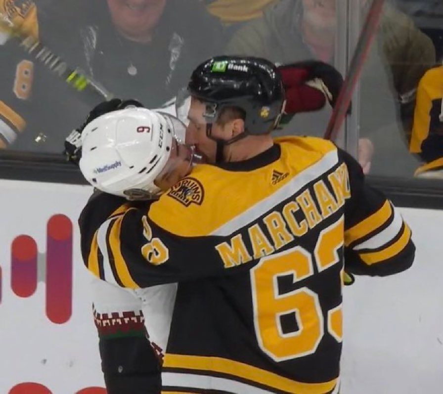 Marchand about to french kiss a Yote