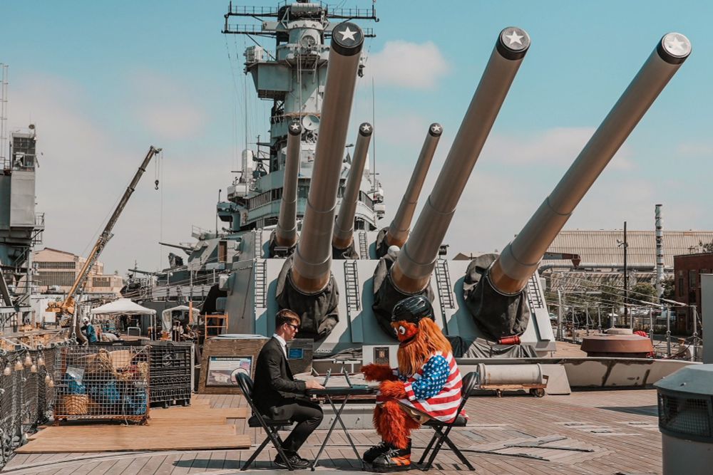 Gritty playing battleship on a battleship