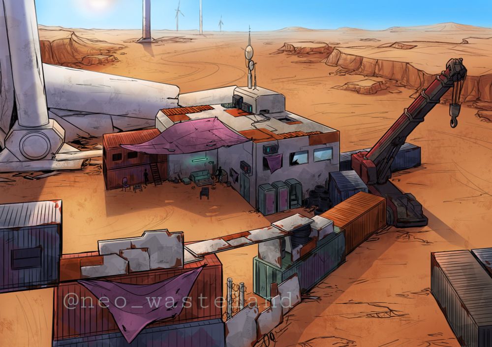 Image shows a buiding in a desert area. There are shipping containers and a crane next to it as well as a broken wind turbine.