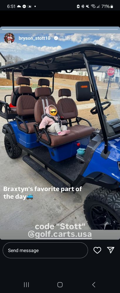 image from bryson stotts insta story. his infant daughter is sitting in a car seat in a golf cart. its captioned "braxtyns favorite part of the day 🚗 code Stott @ golf.carts.usa"