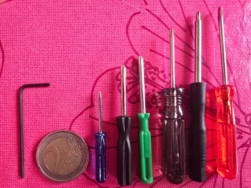 A colourful family of screw drivers, the smallest one being slightly bigger than one and a half two Euro coins 