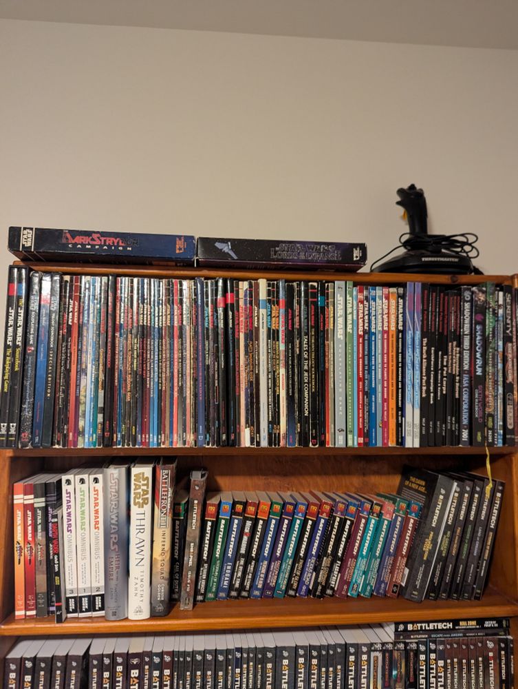 Bookshelf full of Star Wars d6 RPG books from the late 1990s