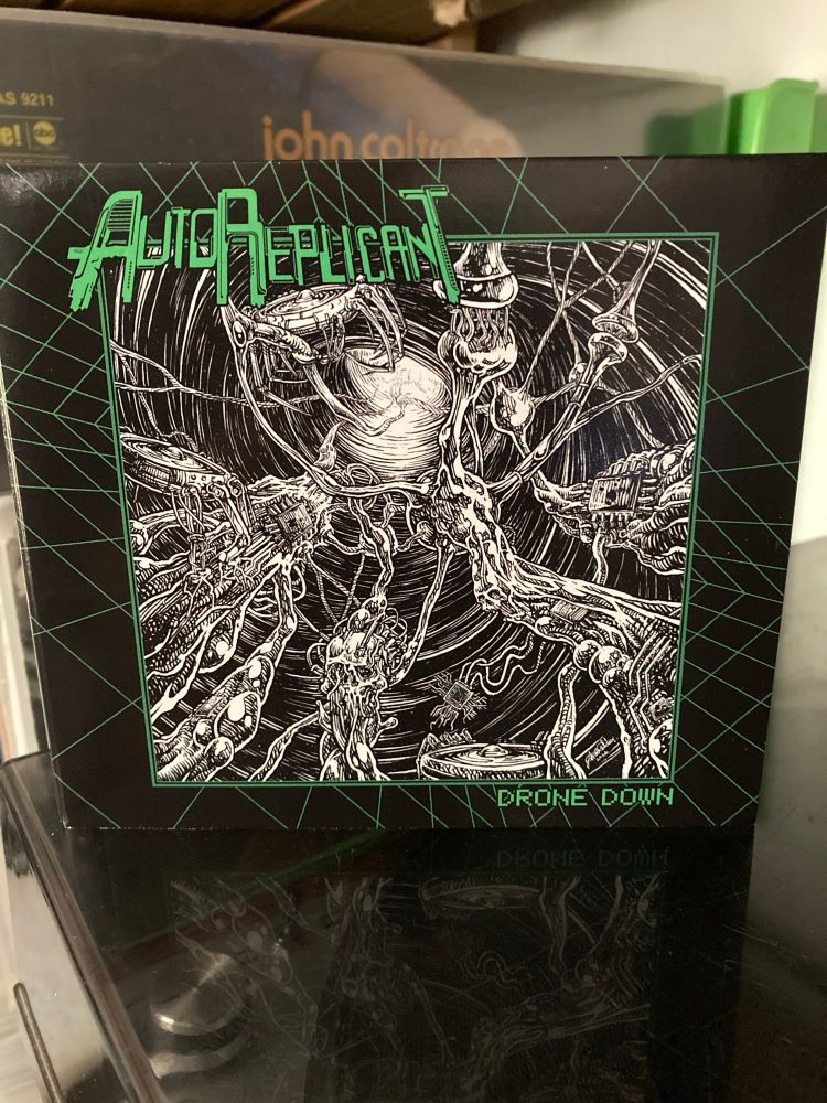 Front of CD packaging of AutoReplicant – Drone Down album.